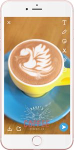 example of a geofilter over a picture of latte art